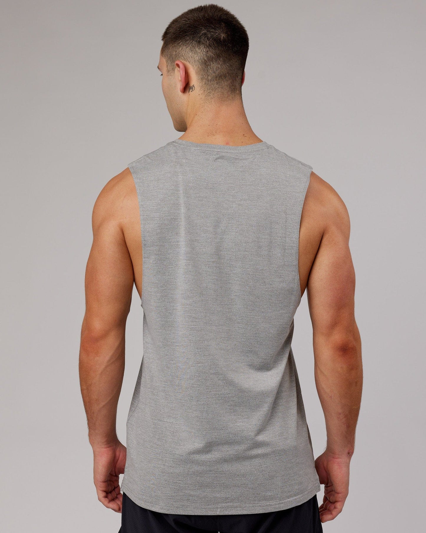 Model wearing Perform VapourFLX Muscle Tank - Light Grey Marl