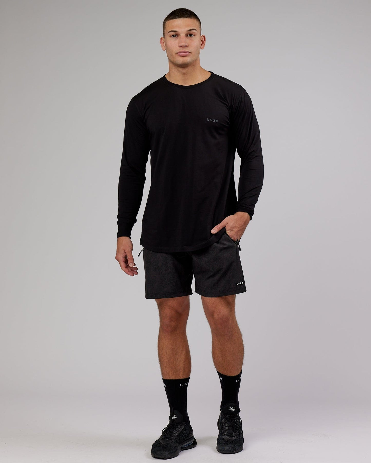 Model wearing Deluxe PimaFLX LS Tee - Black
