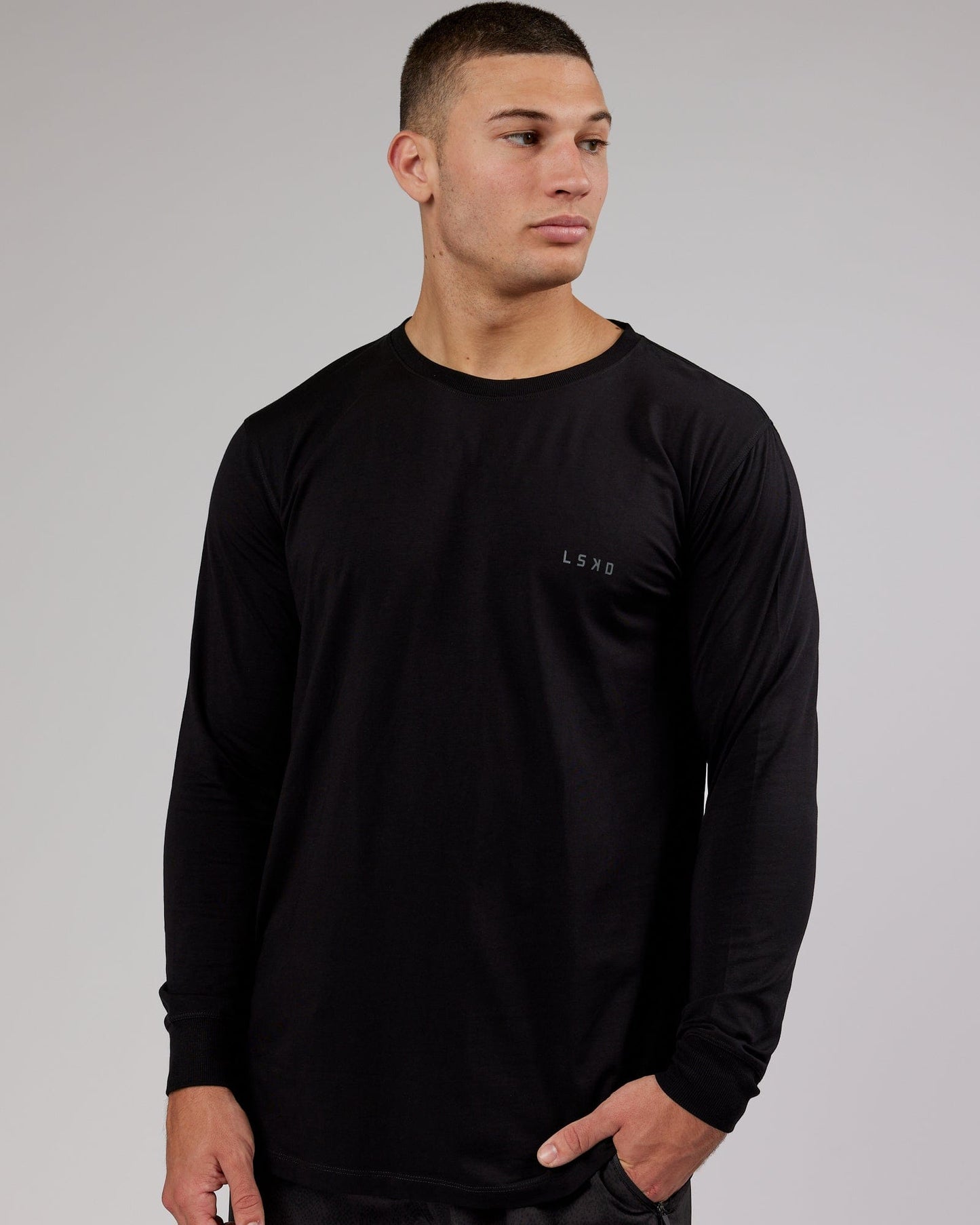 Model wearing Deluxe PimaFLX LS Tee - Black