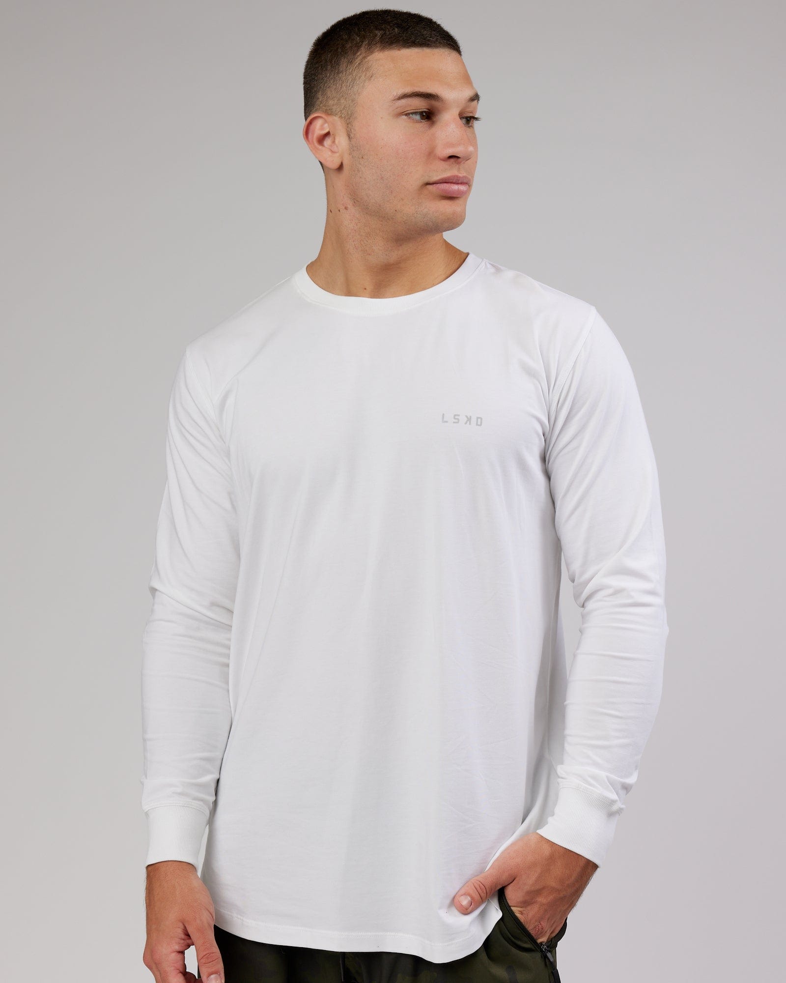 Model wearing Deluxe PimaFLX LS Tee - White