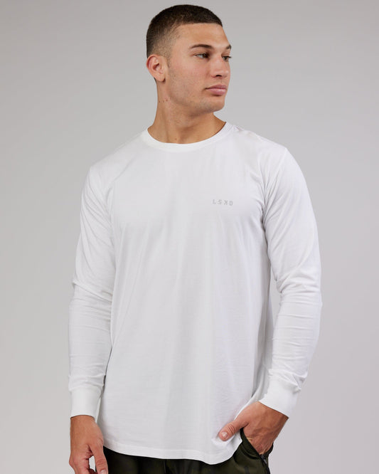 Model wearing Deluxe PimaFLX LS Tee - White