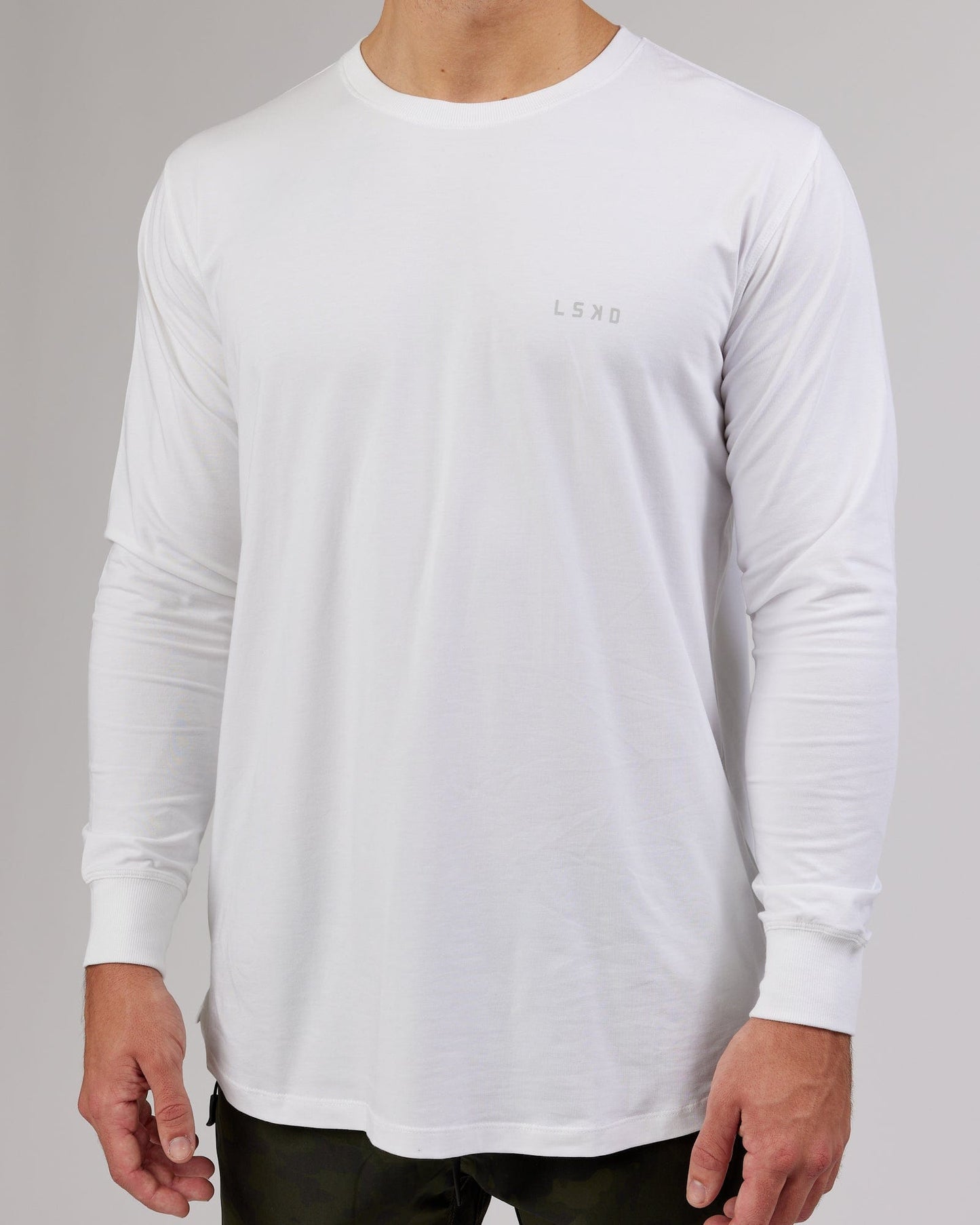 Model wearing Deluxe PimaFLX LS Tee - White