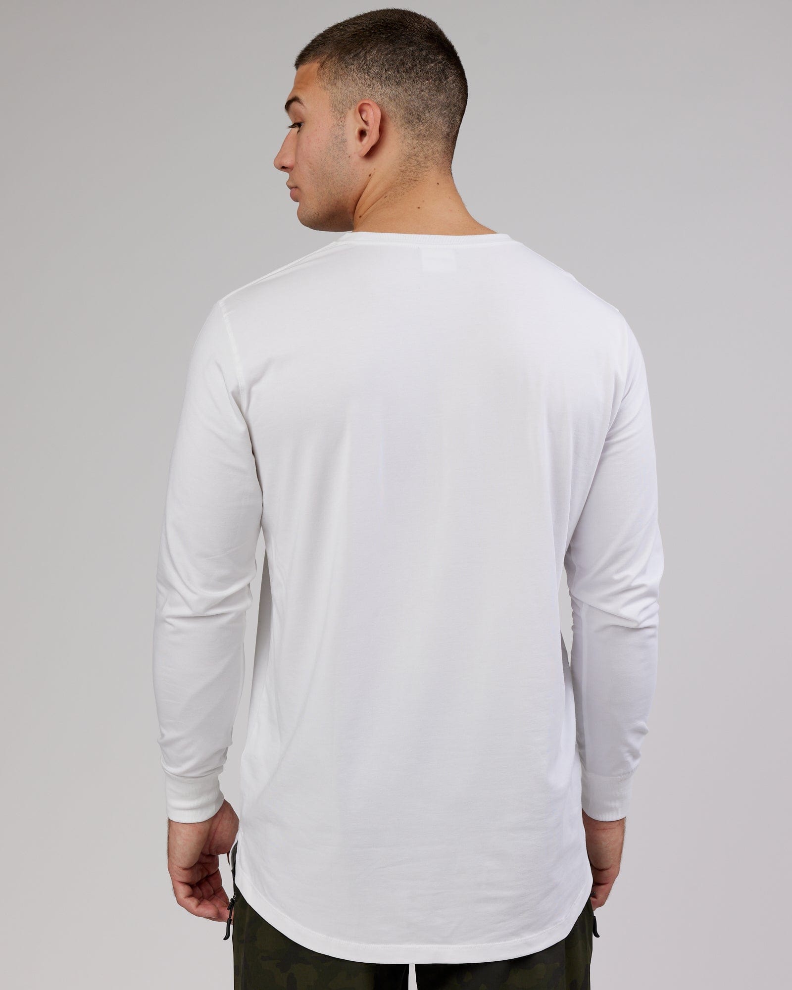 Model wearing Deluxe PimaFLX LS Tee - White
