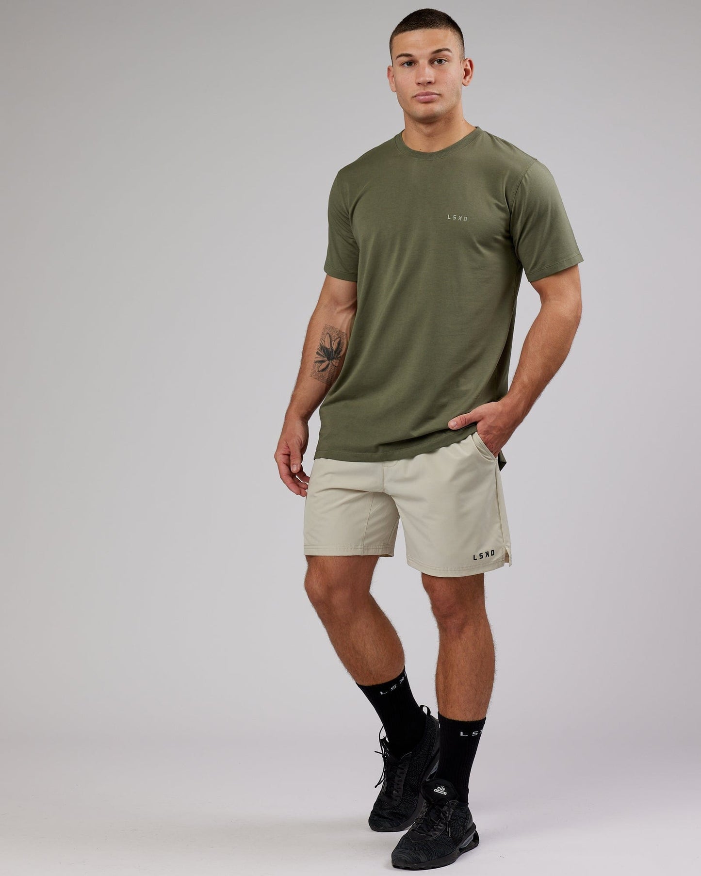 Model wearing Deluxe PimaFLX Tee - Olive Fade