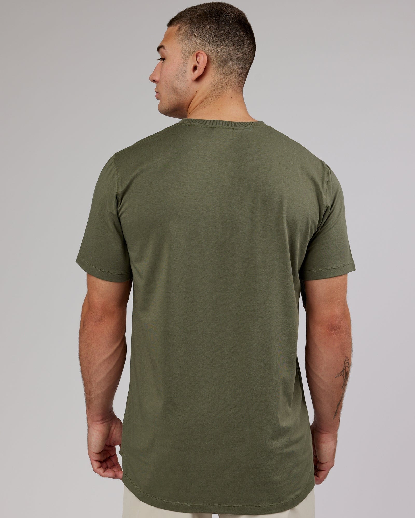 Model wearing Deluxe PimaFLX Tee - Olive Fade