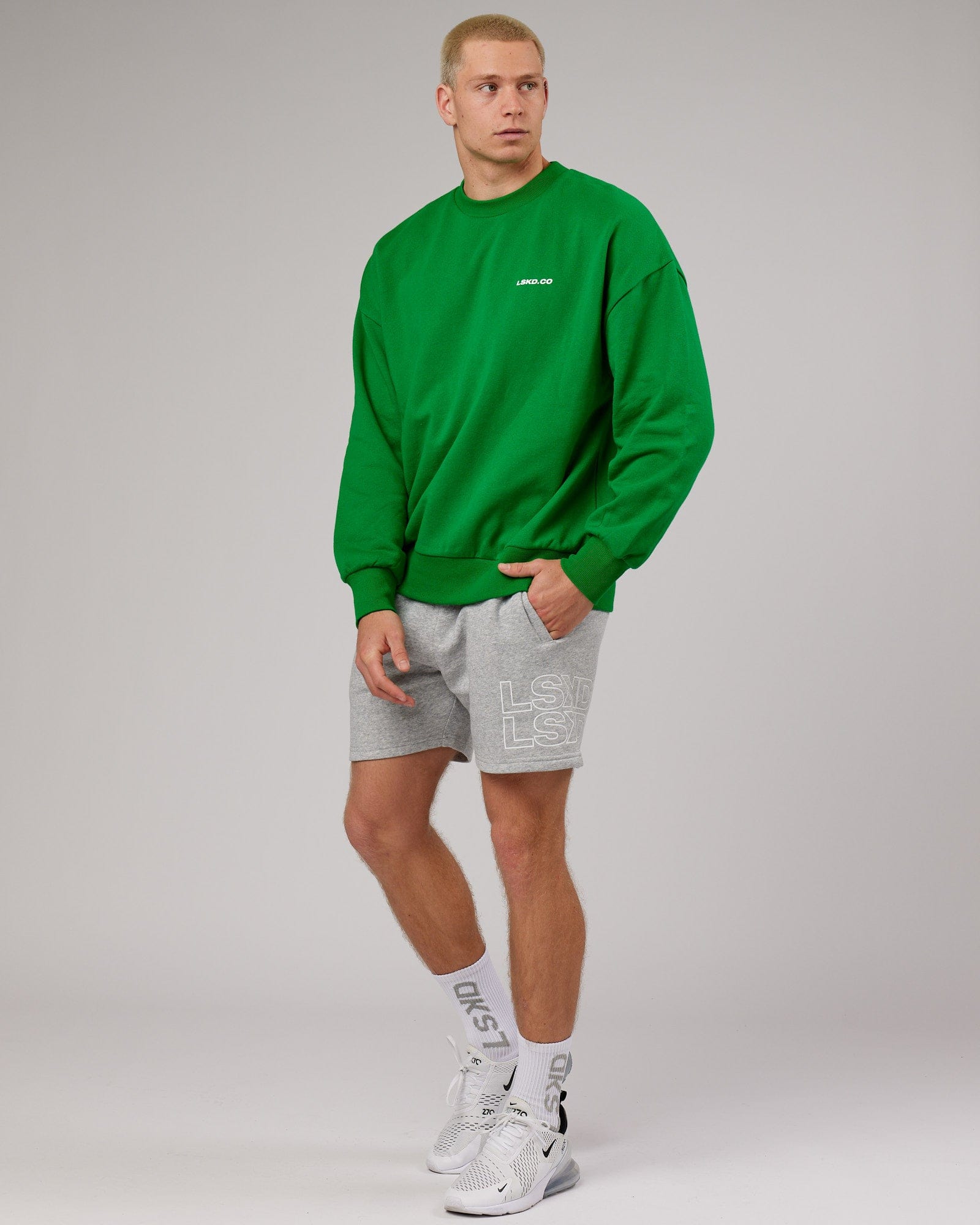 Model wearing Revolutions Oversize Sweater - Vivid Green