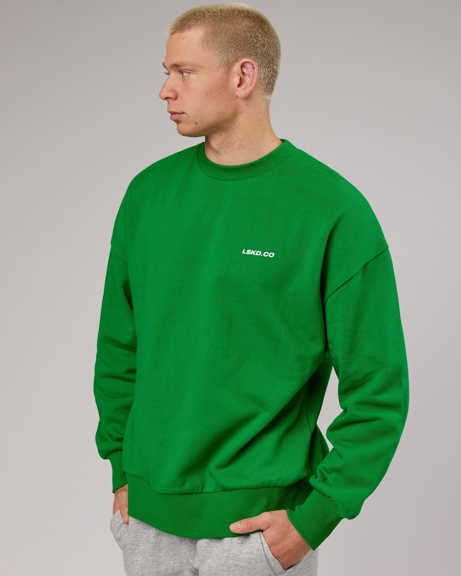 Model wearing Revolutions Oversize Sweater - Vivid Green