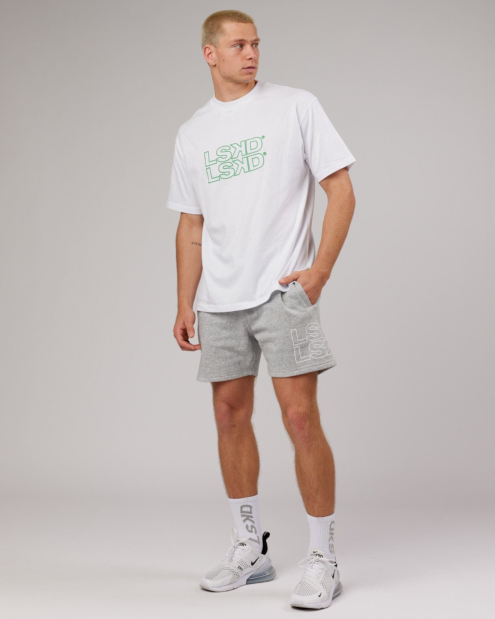 Model wearing Stacks Up Heavyweight Oversize Tee - White-Vivid Green