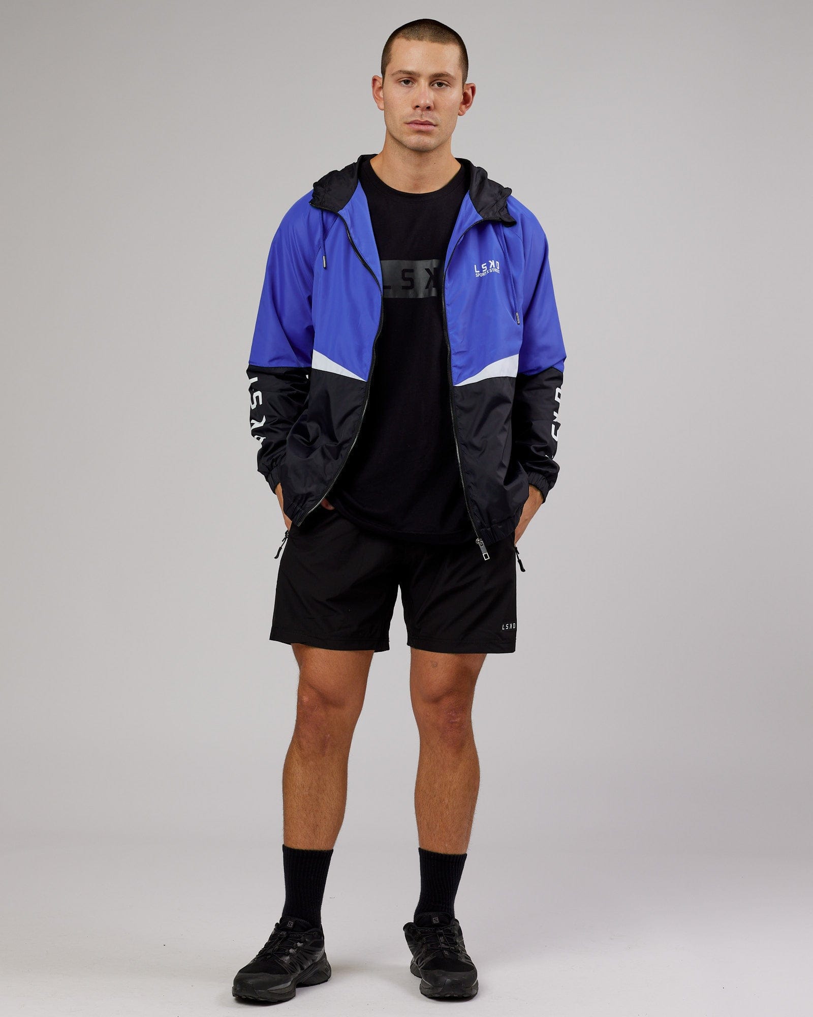 Model wearing Trackside Jacket - Power Cobalt
