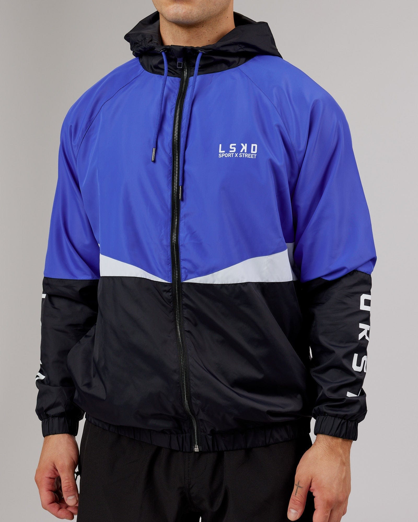 Model wearing Trackside Jacket - Power Cobalt