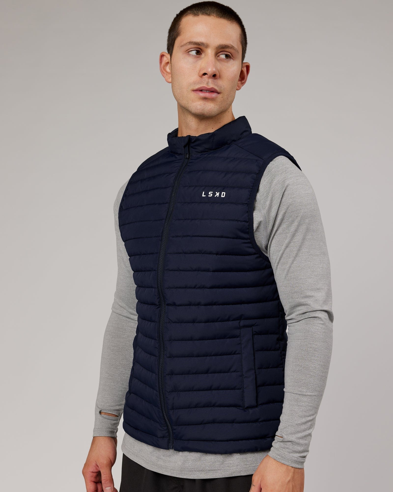 Model wearing Uplift Puffer Vest - Navy