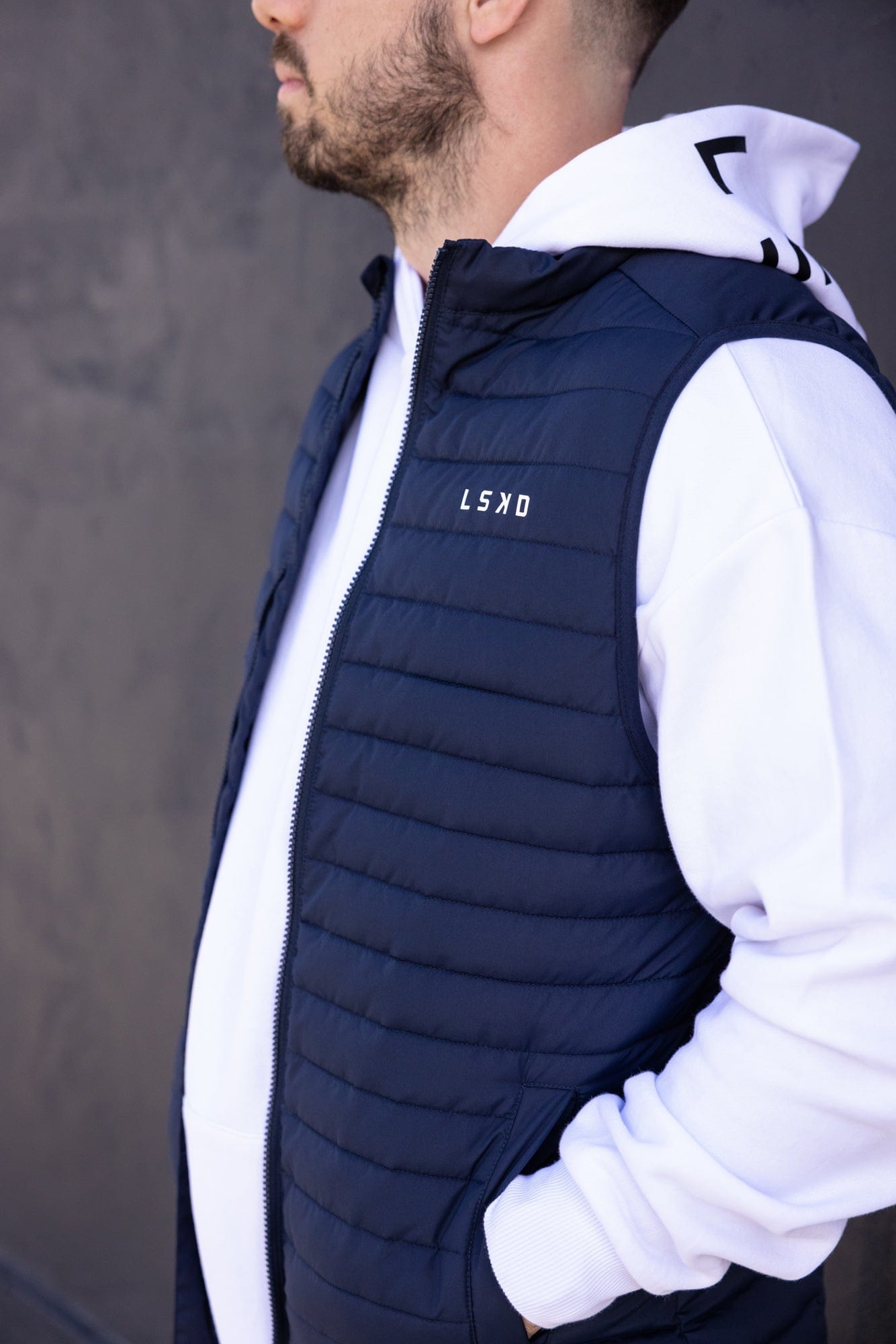 Model wearing Uplift Puffer Vest - Navy