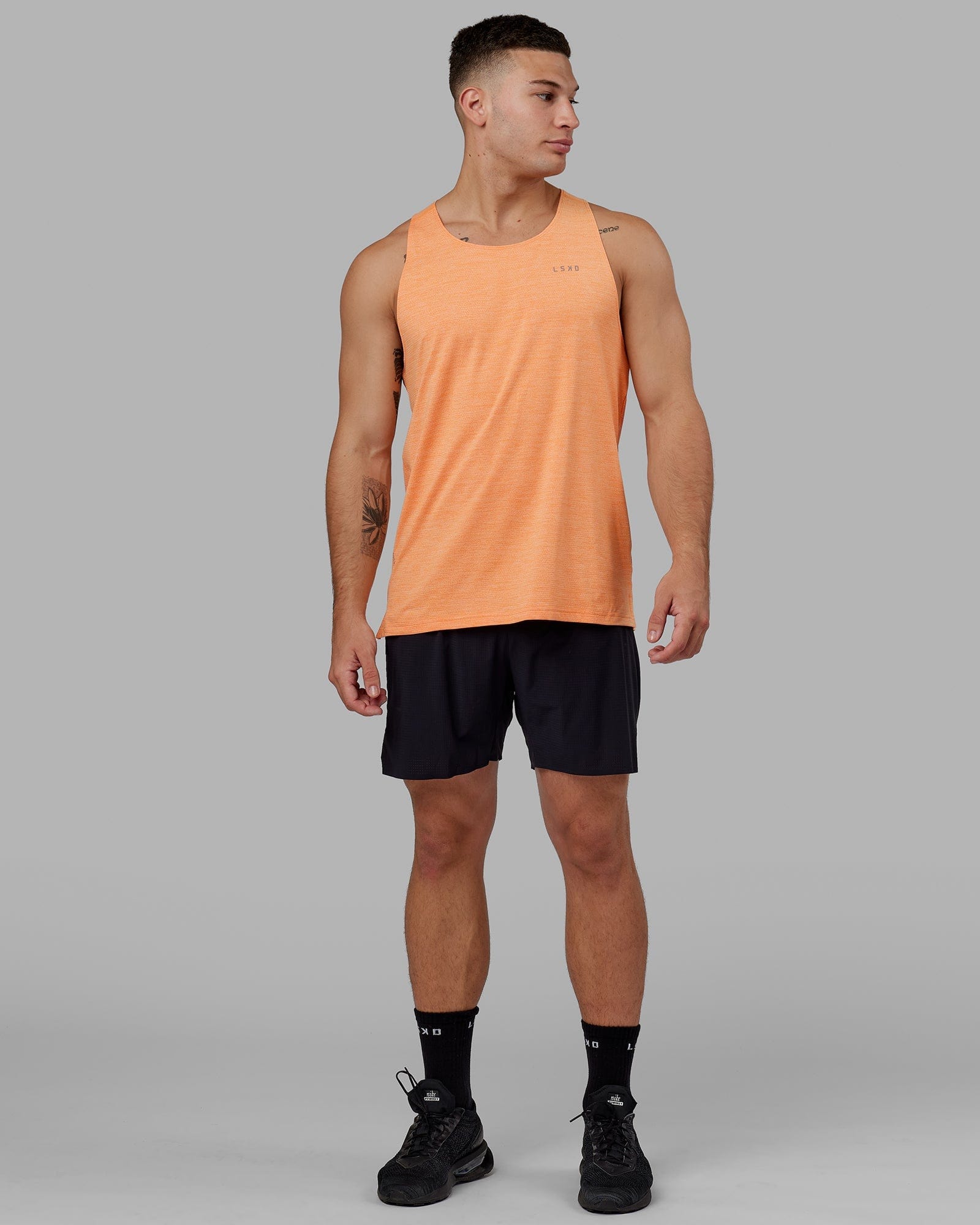 Model wearing Perform VapourFLX Tank - Tangerine Marl