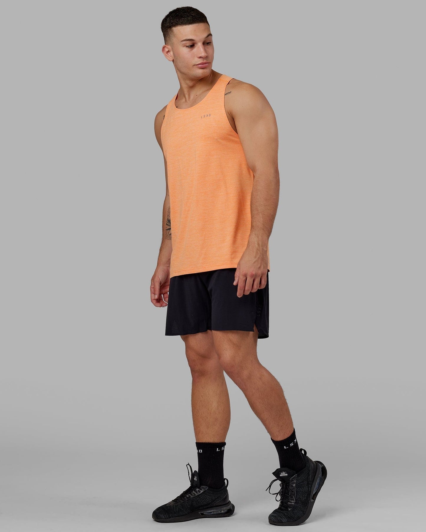 Model wearing Perform VapourFLX Tank - Tangerine Marl