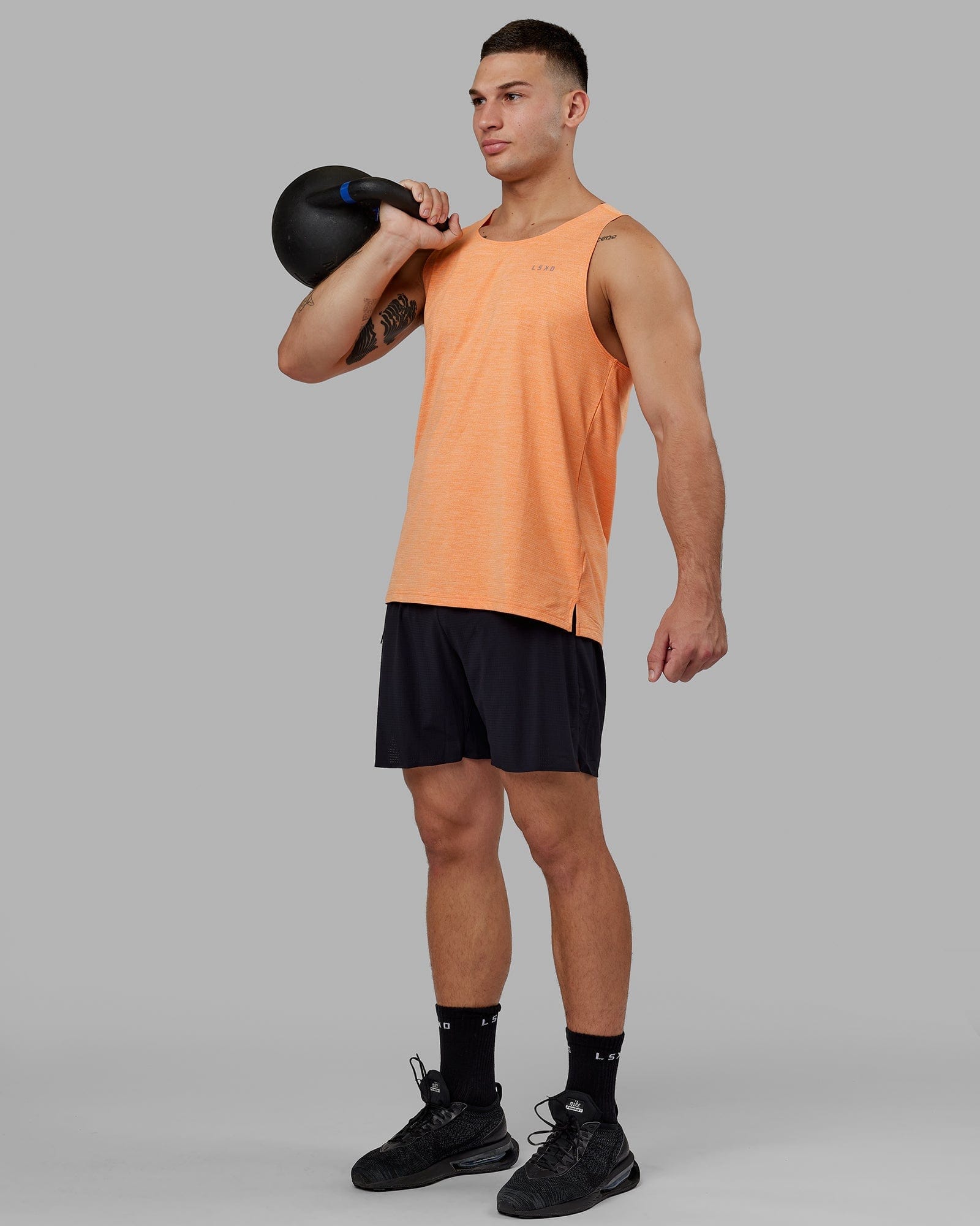 Model wearing Perform VapourFLX Tank - Tangerine Marl