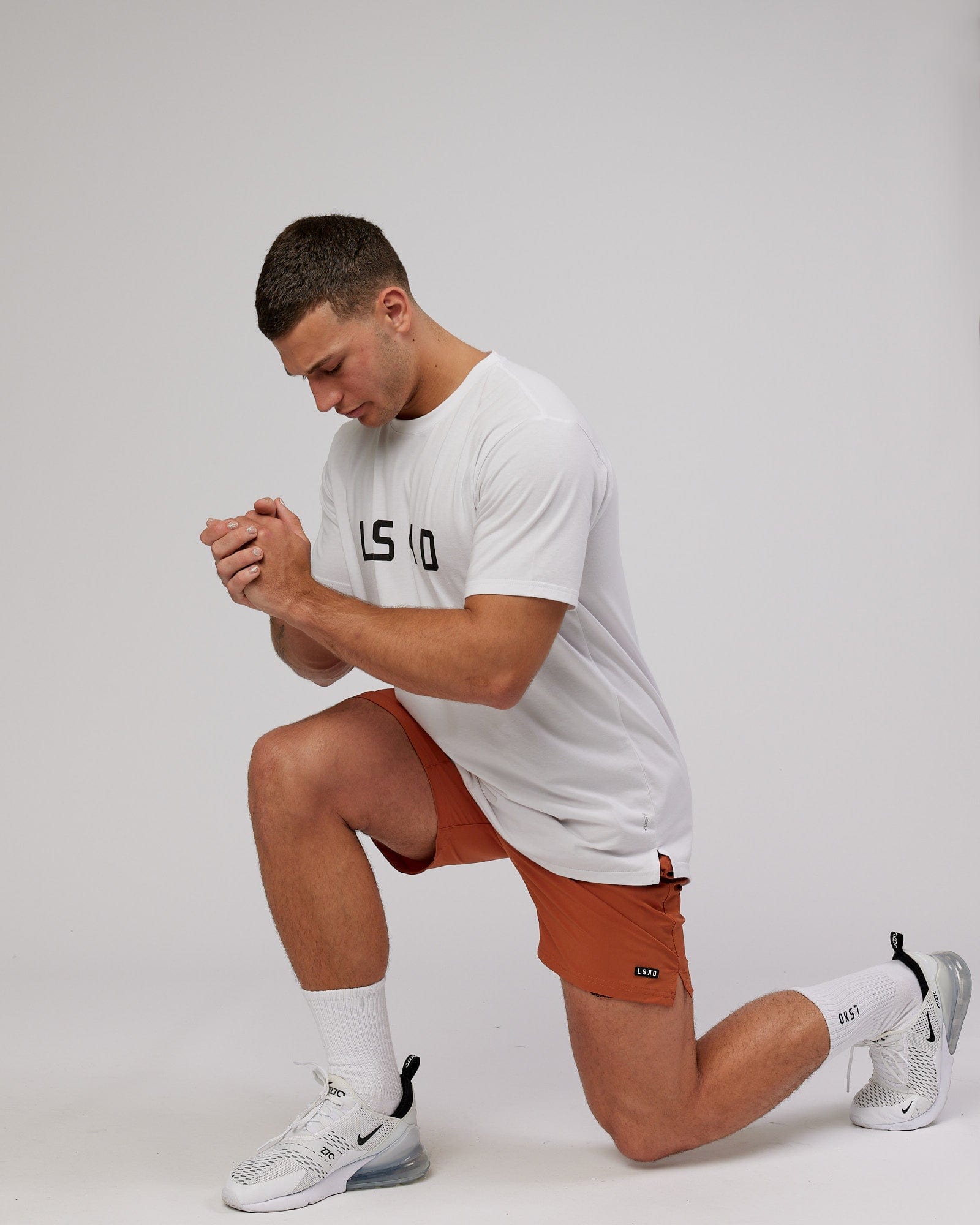 Model wearing Power FLXDRY Performance Tee - White-Black