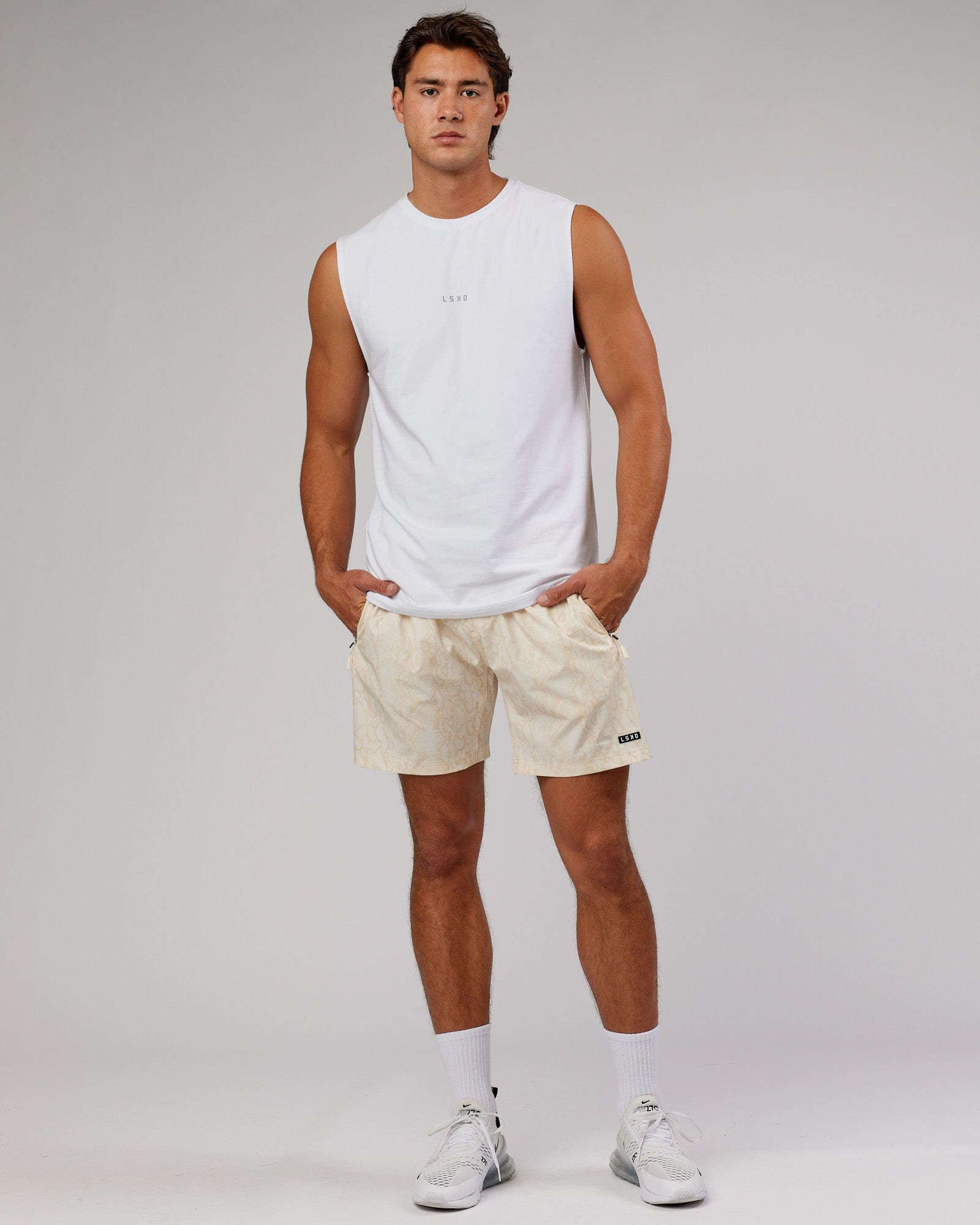 Model wearing Rep 7'' Performance Short - Almond Snakeskin