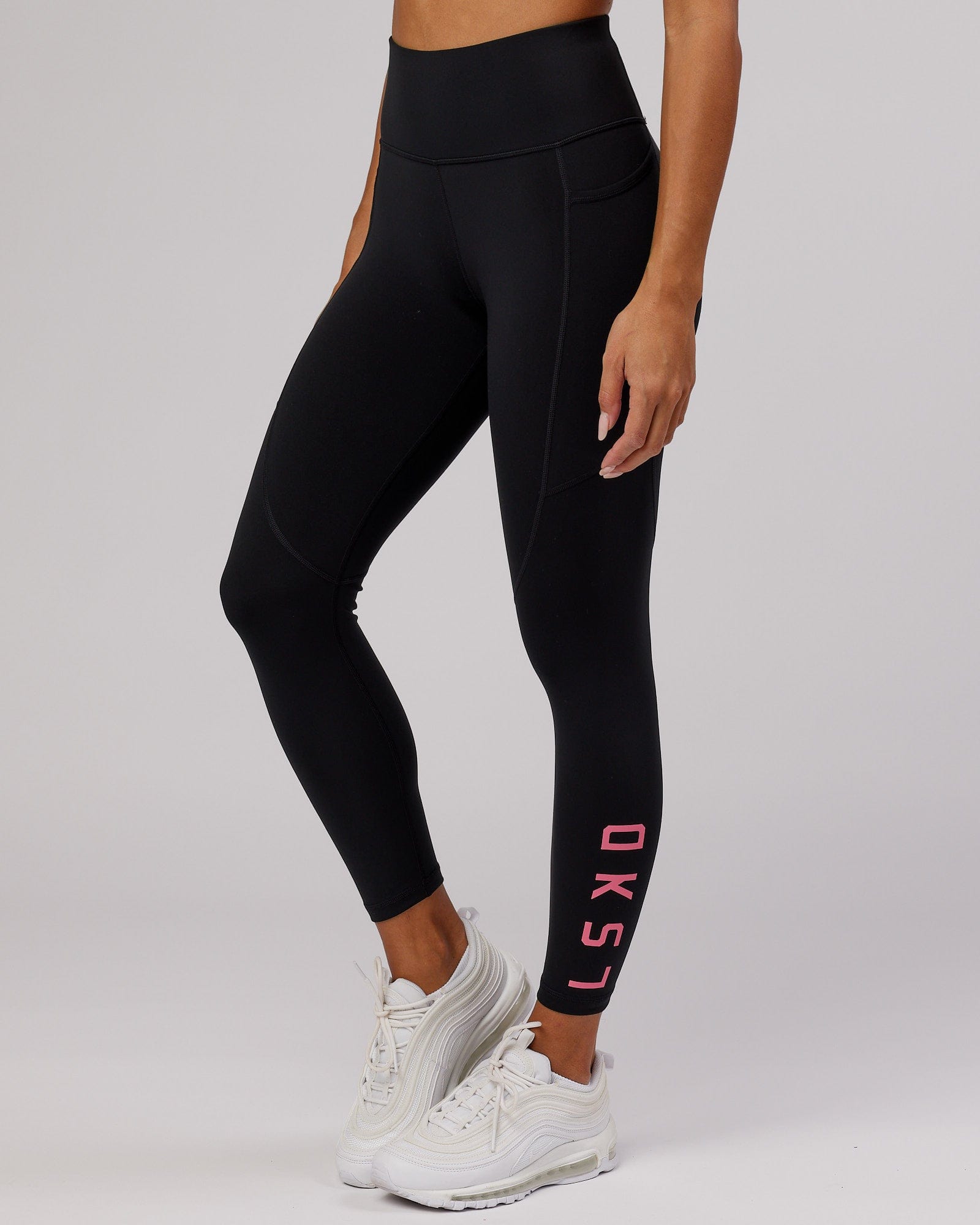 Model wearing Rep 7/8 Length Tight - Black-Flamingo