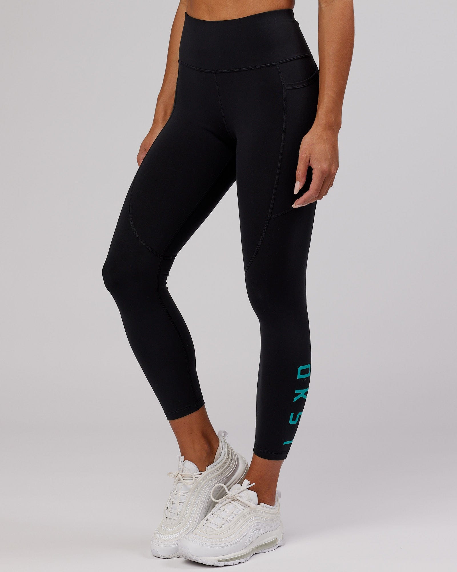 Model wearing Rep 7/8 Length Tight - Black-Hyper Teal