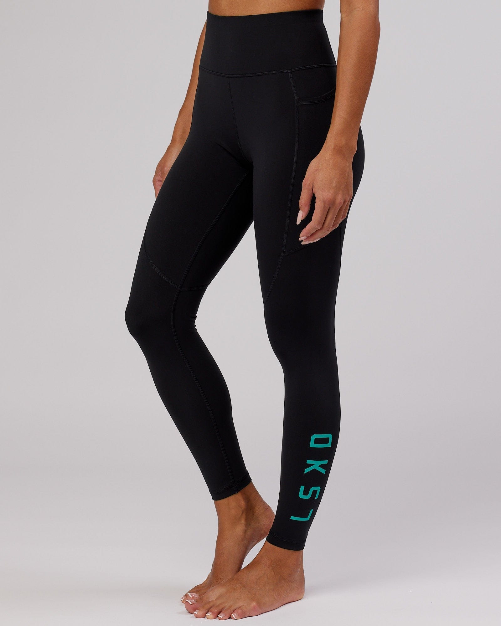 Model wearing Rep Full Length Tight - Black-Hyper Teal