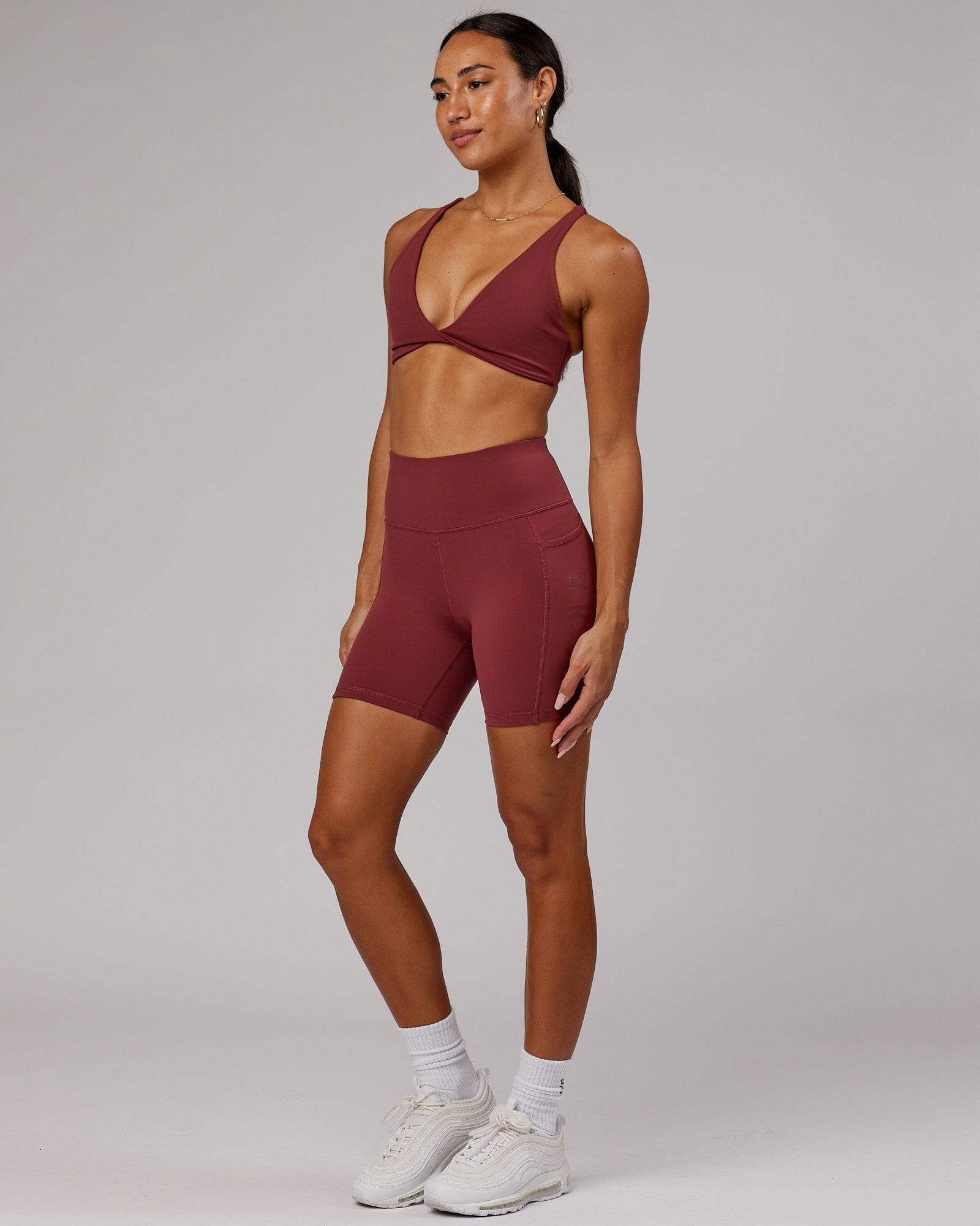 Model wearing Rep Mid Short Tight - Apple Berry