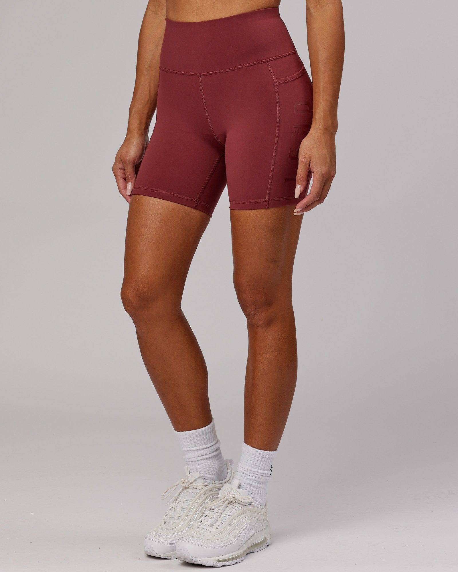 Model wearing Rep Mid Short Tight - Apple Berry