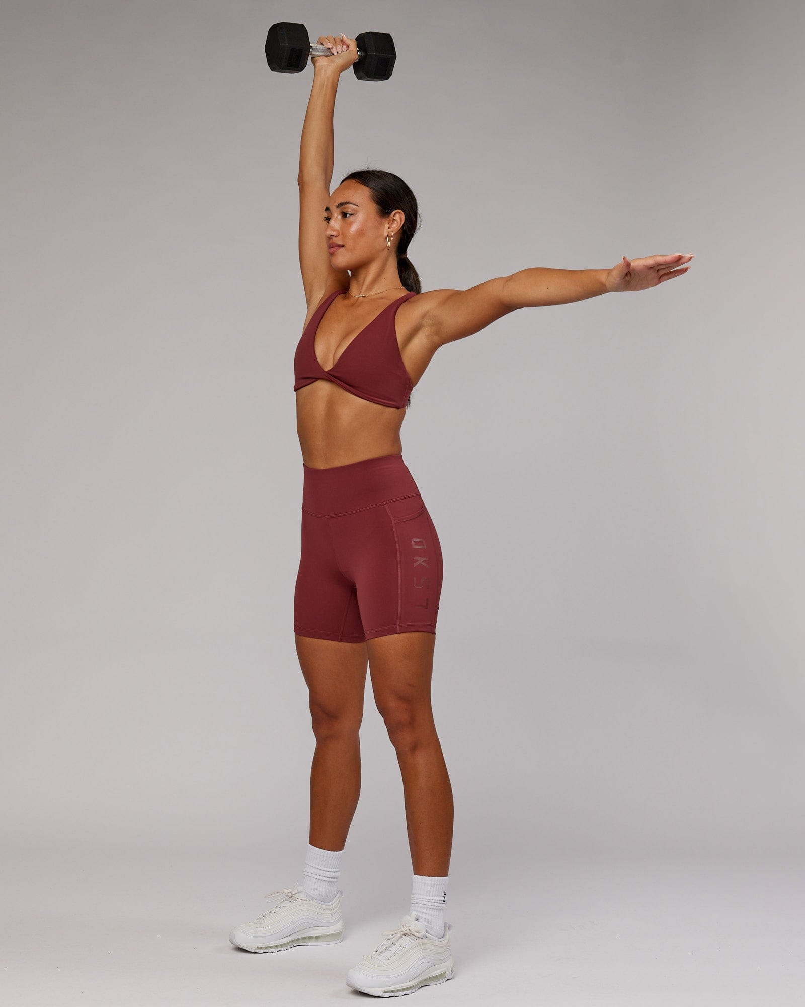 Model wearing Rep Mid Short Tight - Apple Berry