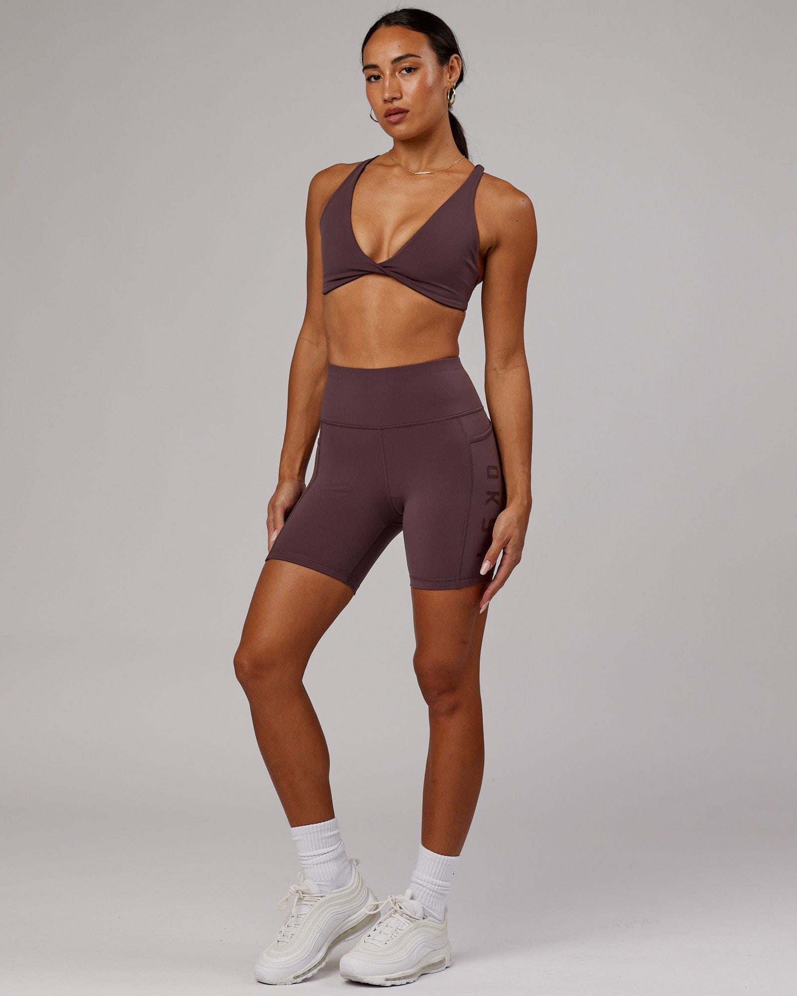 Model wearing Rep Mid Short Tight - Plum