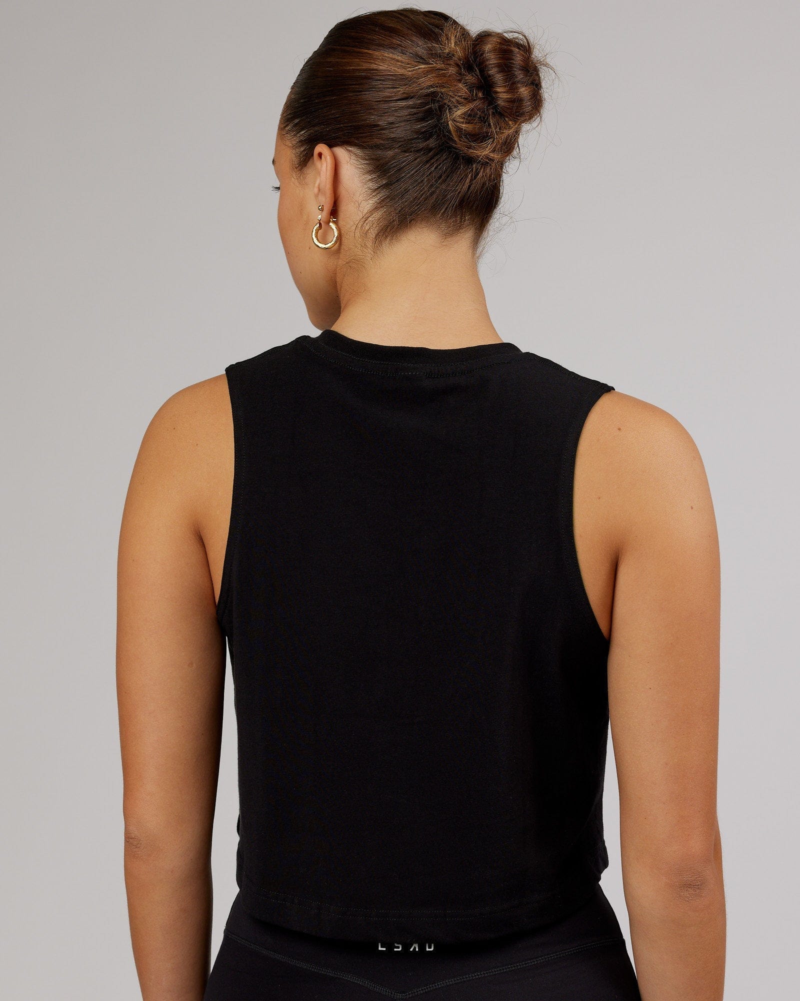 Model wearing Speedway FLXCotton Cropped Tank - Black