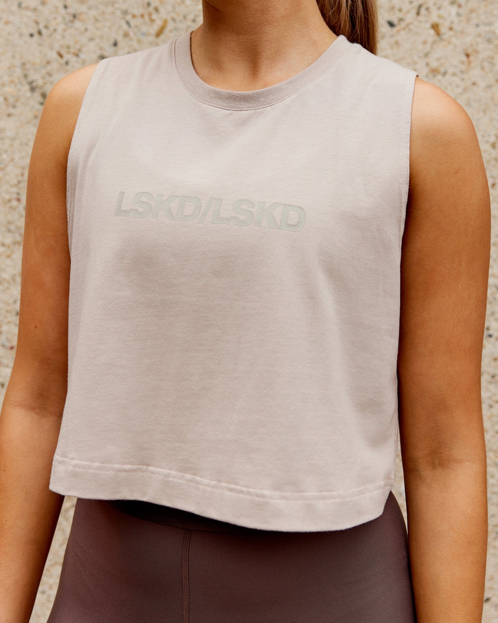Model wearing Speedway FLXCotton Cropped Tank - Taupe