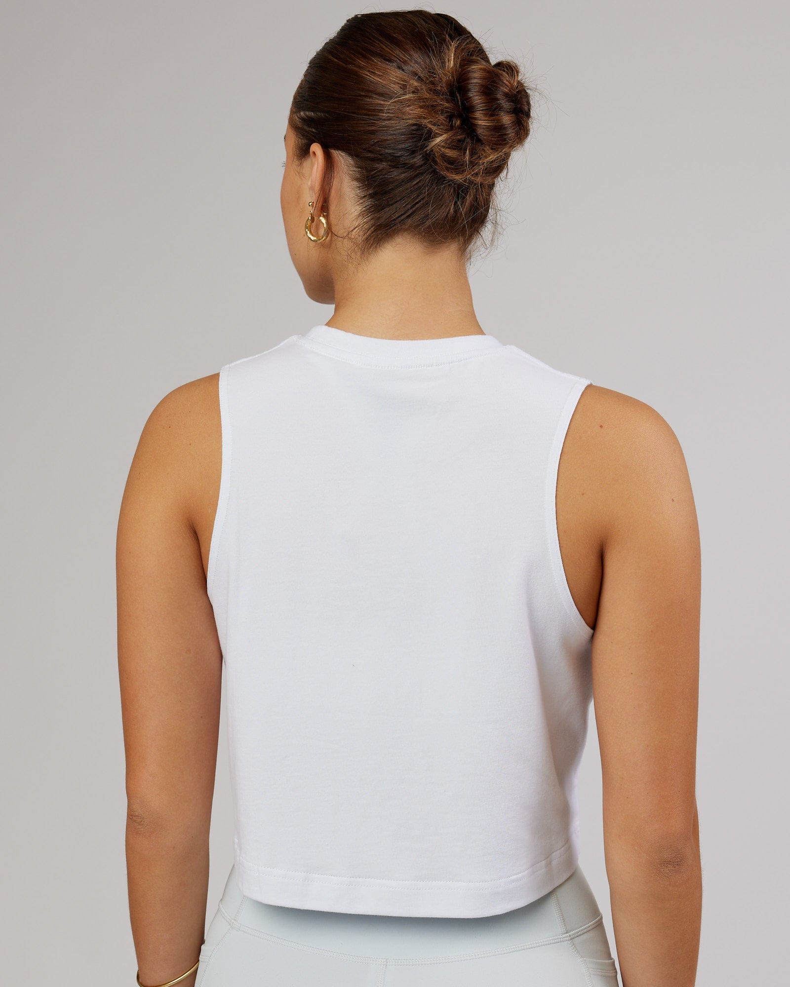 Model wearing Speedway FLXCotton Cropped Tank - White