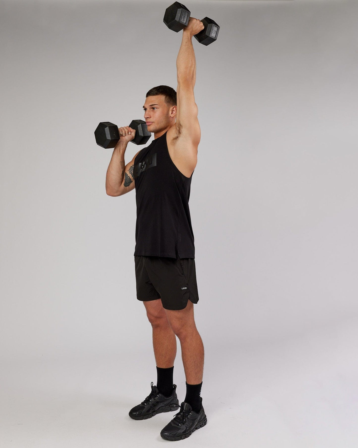 Model wearing Strength FLXCotton Training Fit Tank - Black-Black