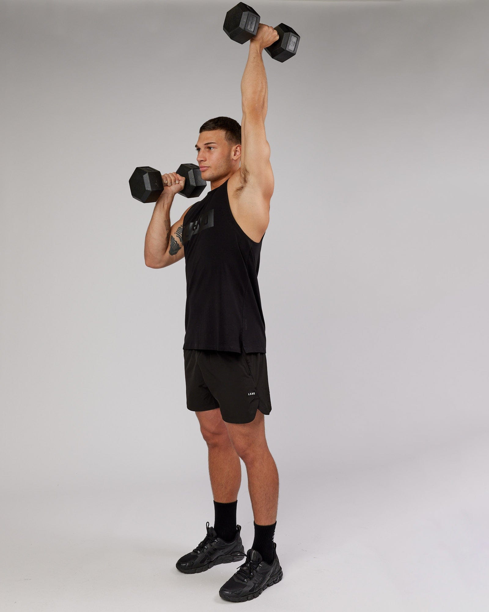 Model wearing Strength FLXCotton Training Fit Tank - Black-Black