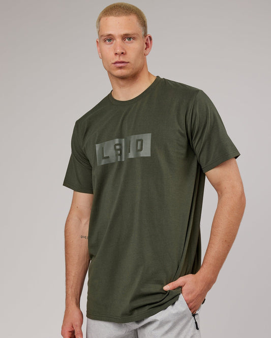 Model wearing Strength FLXDRY Performance Tee - Forest Night
