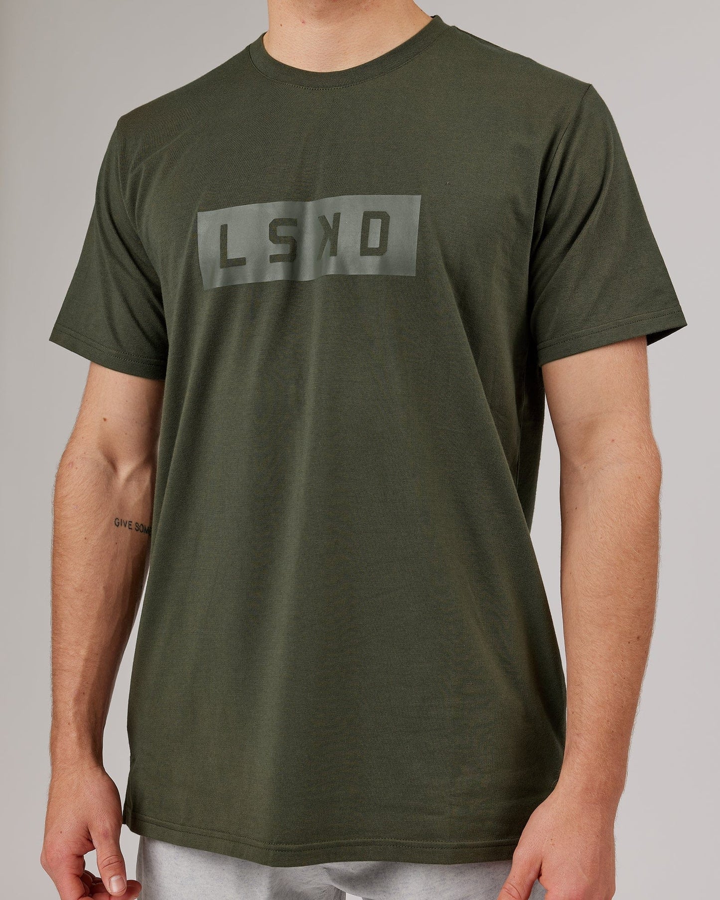 Model wearing Strength FLXDRY Performance Tee - Forest Night