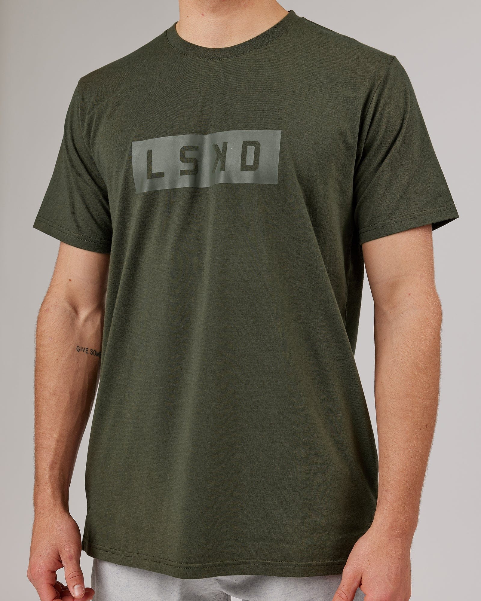 Model wearing Strength FLXDRY Performance Tee - Forest Night