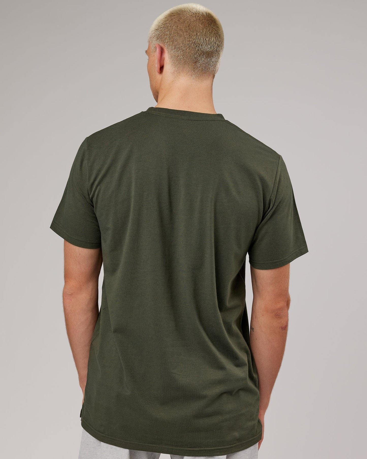 Model wearing Strength FLXDRY Performance Tee - Forest Night