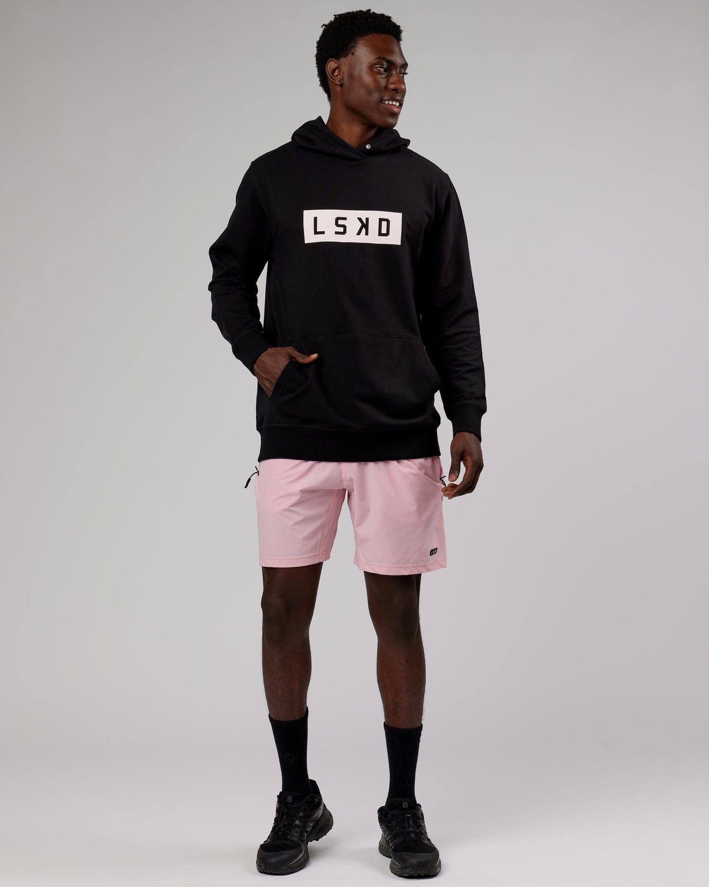 Model wearing Strength FLXFleece Hoodie - Black-Pink