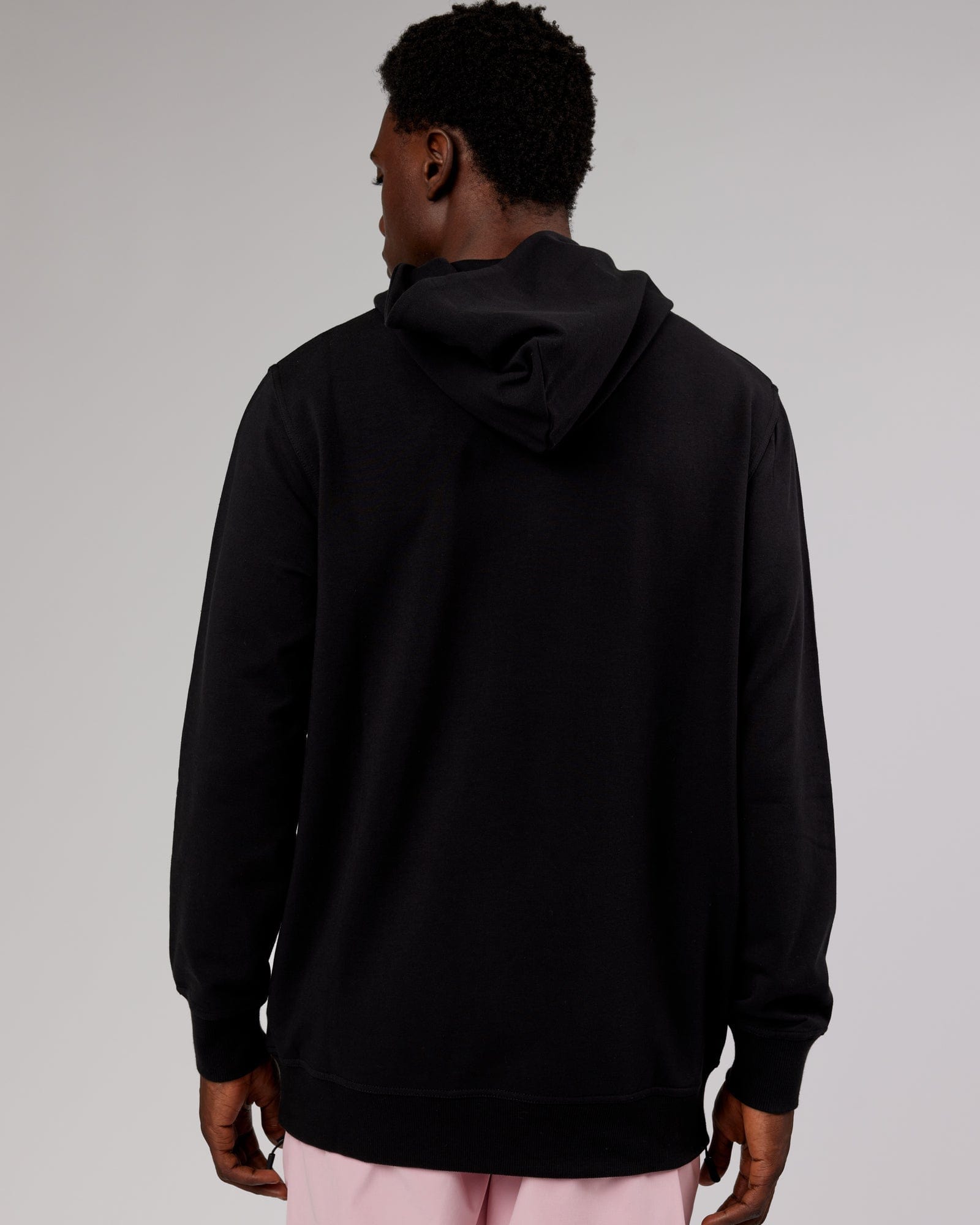 Model wearing Strength FLXFleece Hoodie - Black-Pink