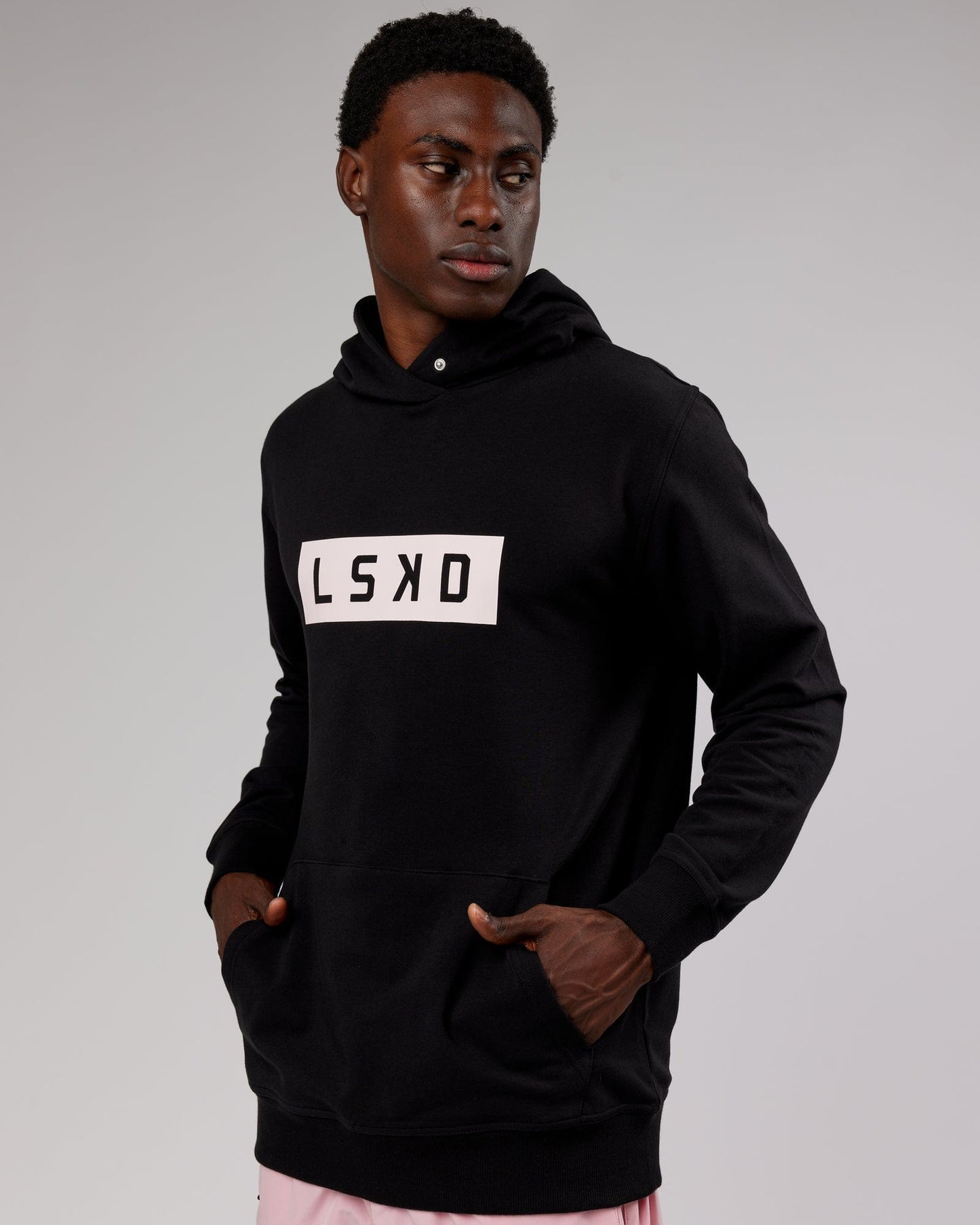 Model wearing Strength FLXFleece Hoodie - Black-Pink