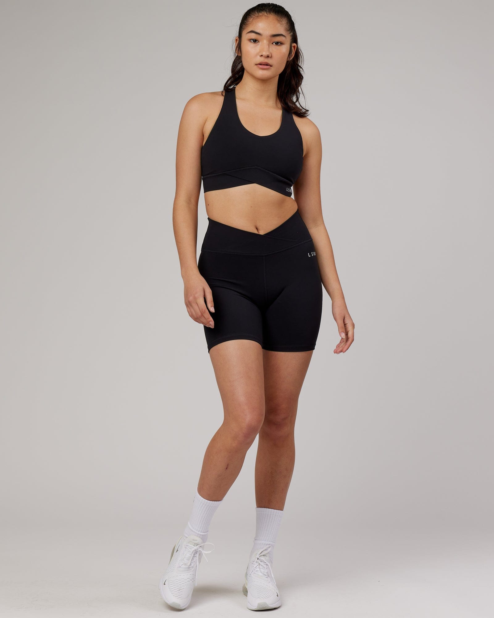 Model wearing Strike Sports Bra - Black