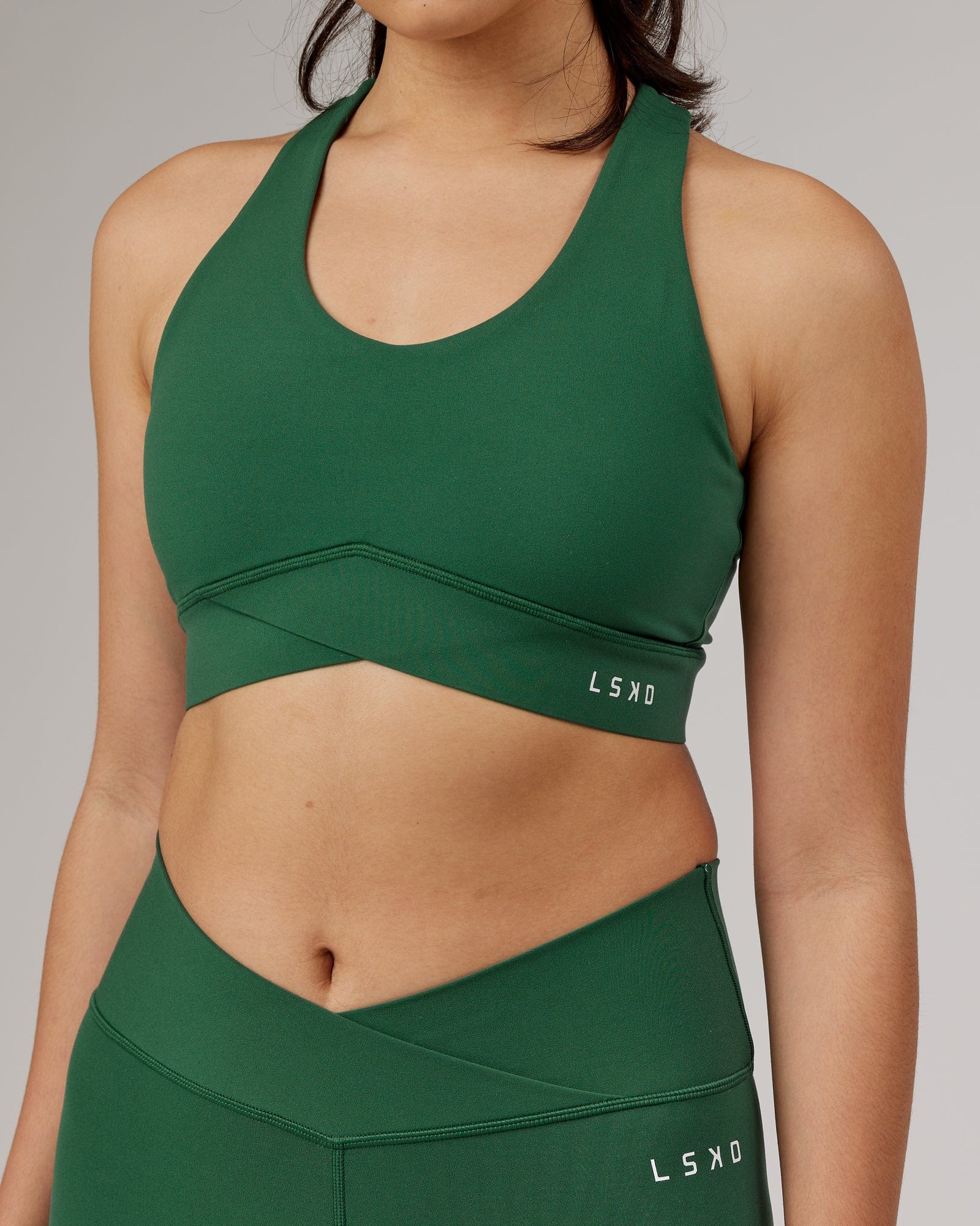 Model wearing Strike Sports Bra - Pineneedle