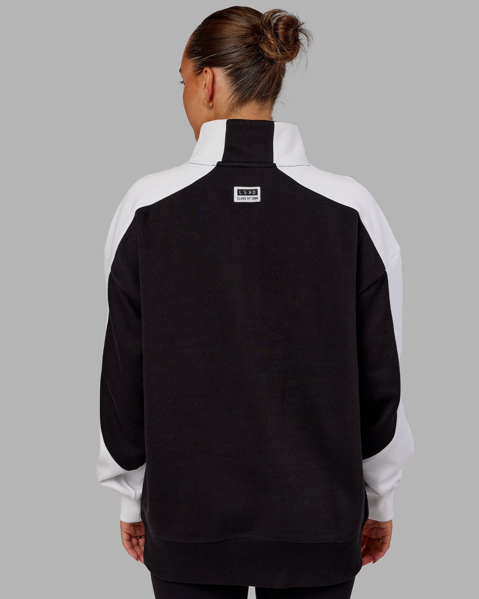 Model wearing Unisex Alumni 1/4 Zip Sweater Oversize - Black-White
