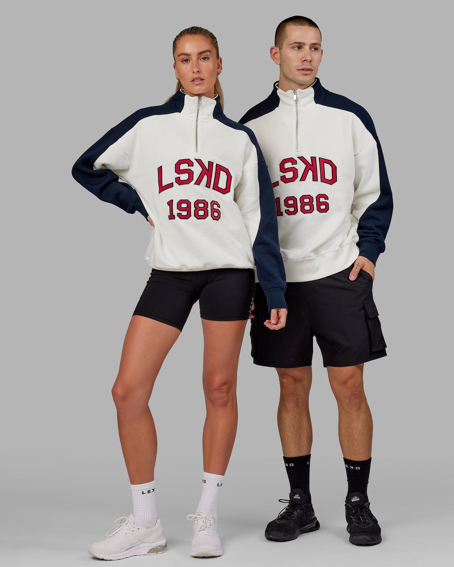 Model wearing Unisex Alumni 1/4 Zip Sweater Oversize - Navy-Red