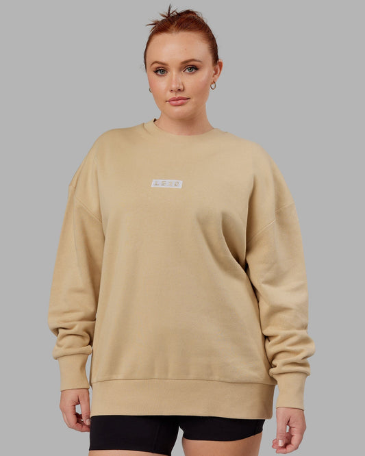 Model wearing Unisex Cornerstone Sweater Oversize - Pale Khaki