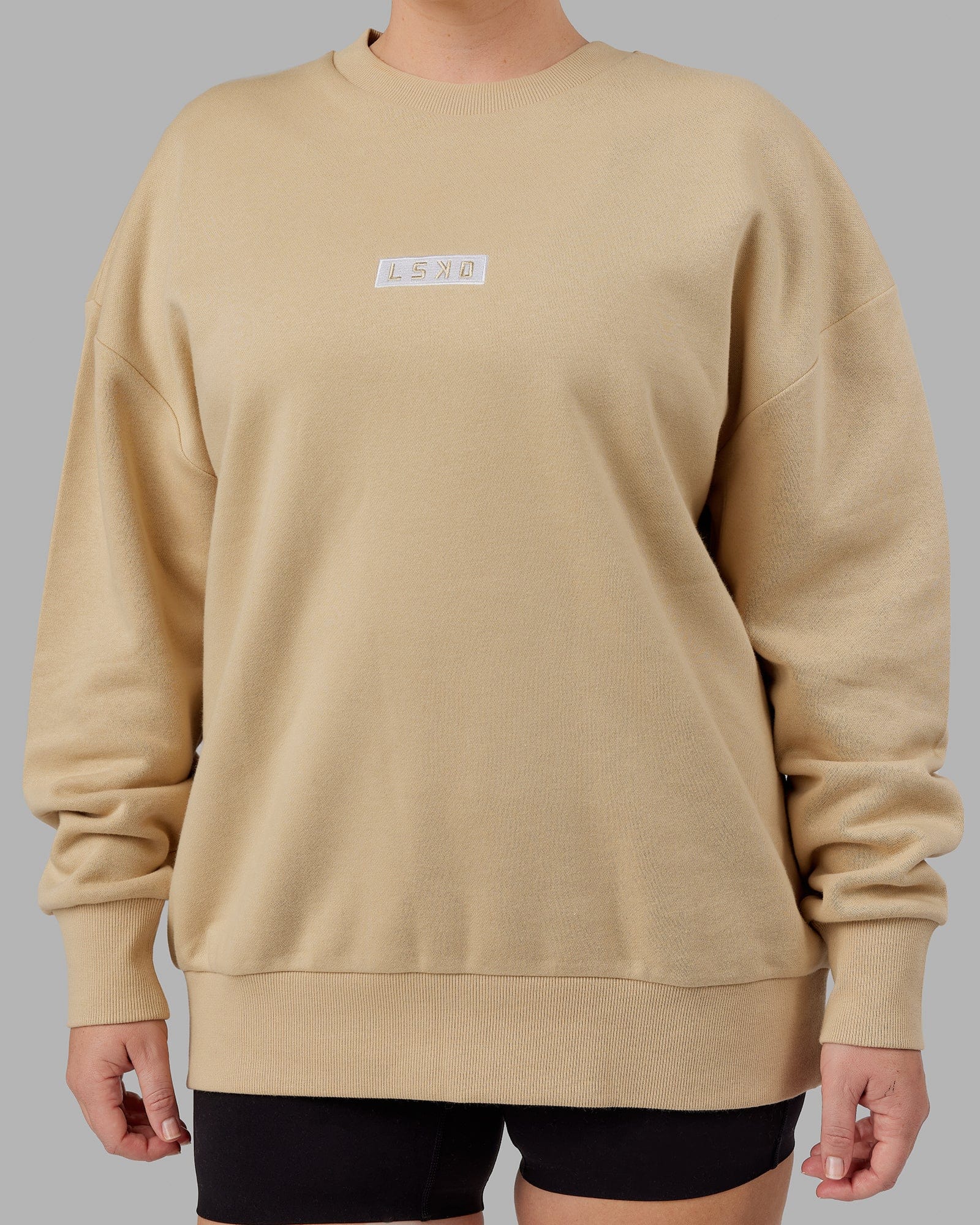 Model wearing Unisex Cornerstone Sweater Oversize - Pale Khaki