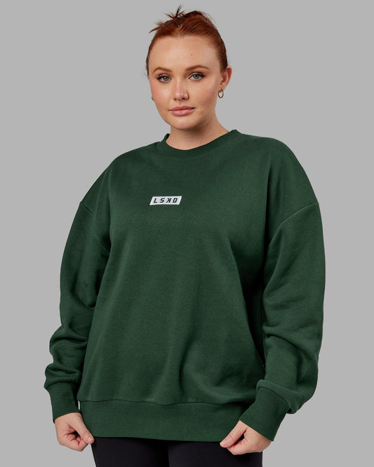 Model wearing Unisex Cornerstone Sweater Oversize - Pineneedle