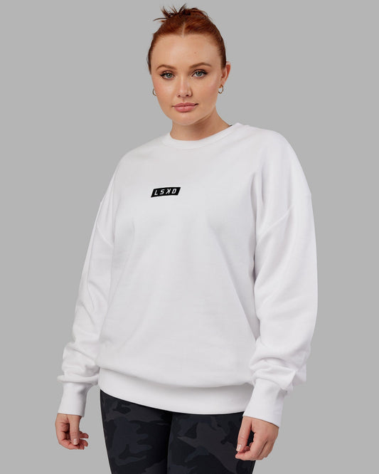 Model wearing Unisex Cornerstone Sweater Oversize - White