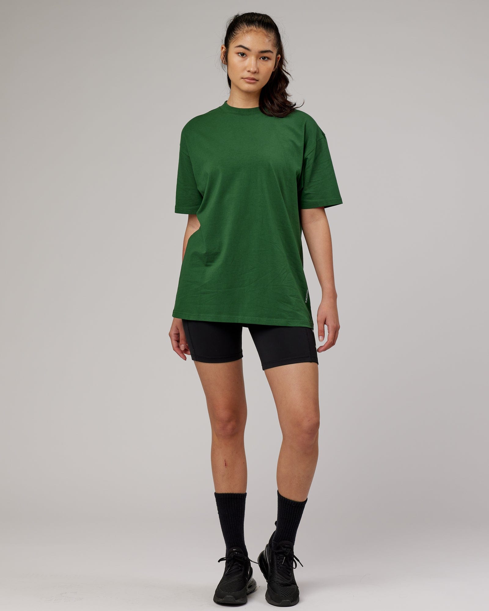Model wearing Unisex DownLow FLXCotton Oversize Tee - Pineneedle