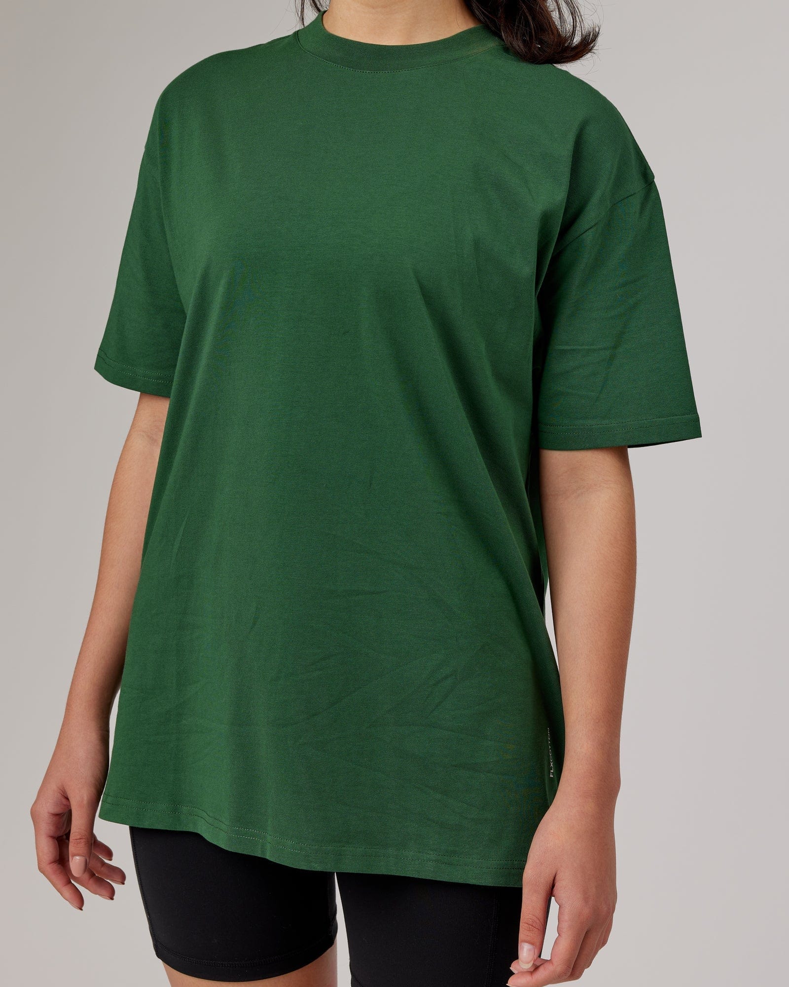 Model wearing Unisex DownLow FLXCotton Oversize Tee - Pineneedle